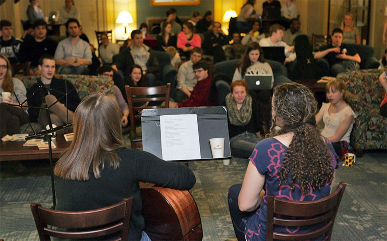 Scholars playing and signing at SHC Coffeehouse session