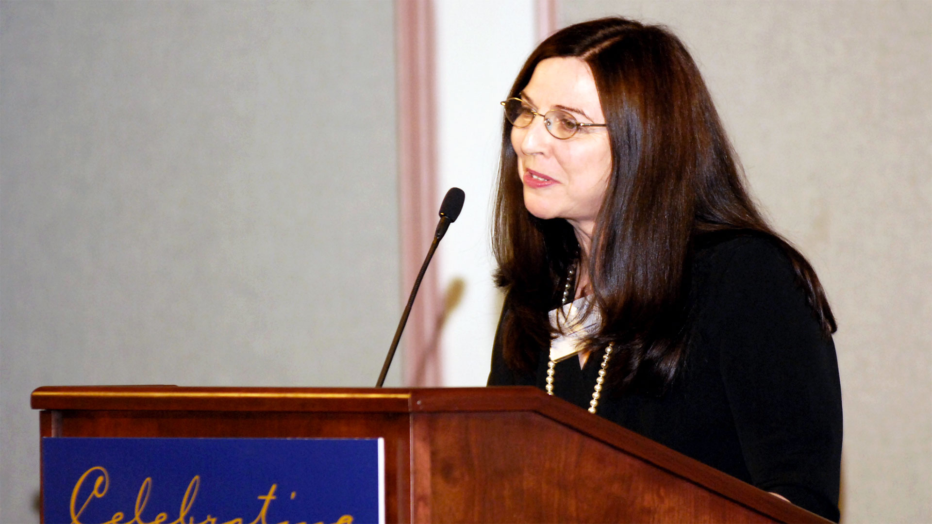 Dean Cheryl Achterberg speaking at an event