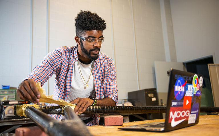 Schreyer Scholar Kriston Ramdass working on his thesis