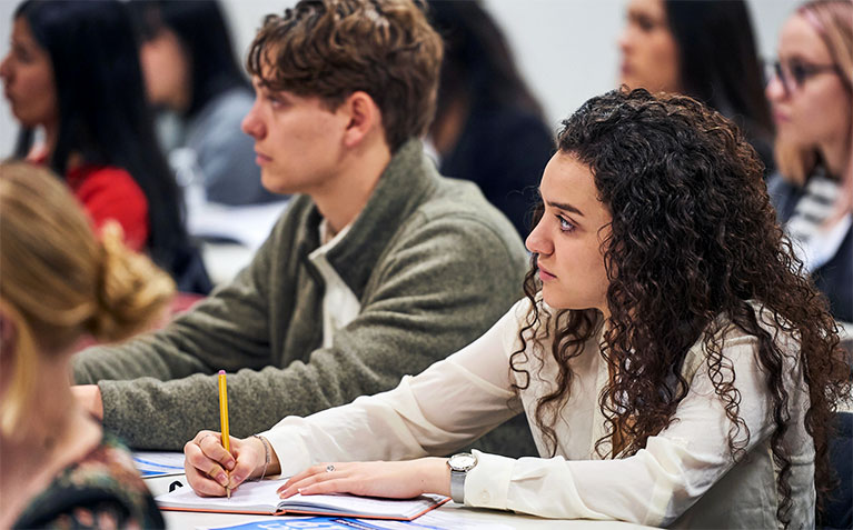 Schreyer Scholars taking notes in class