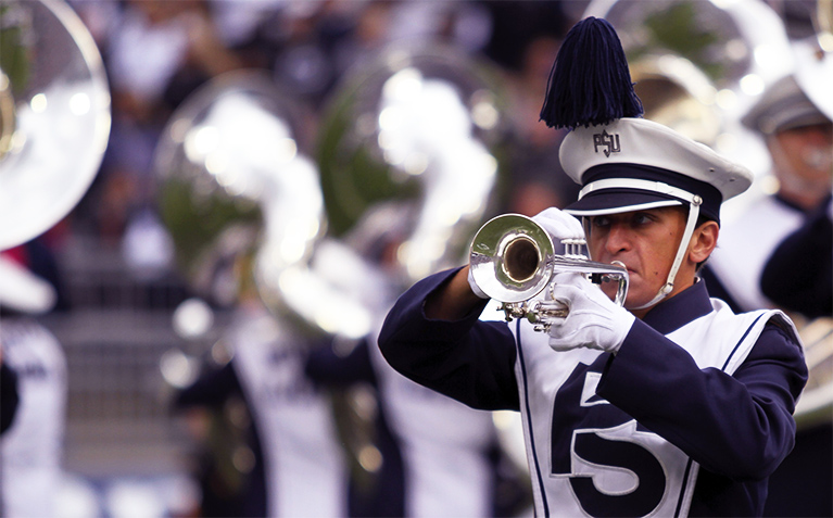 Schreyer Scholar playing trumpet in the Blue Band