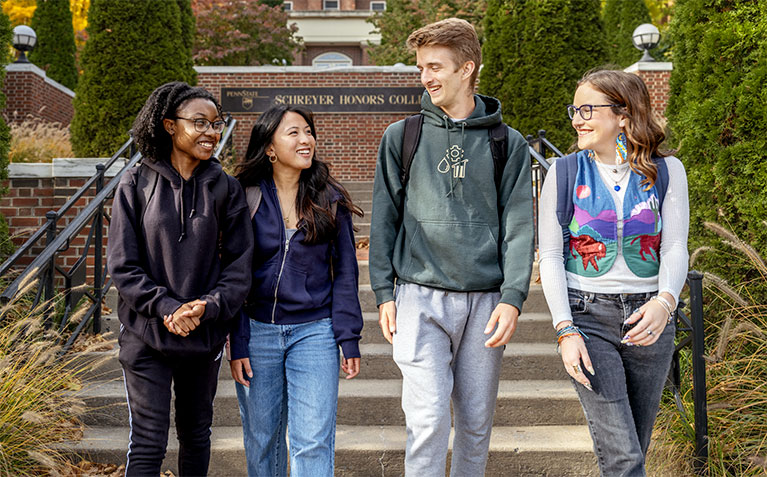 Schreyer Scholars walking down the front steps of Atherton Hall