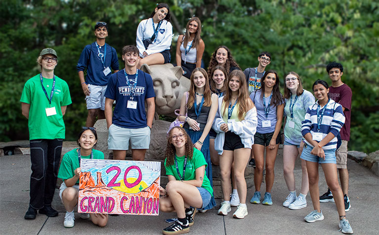 SHO TIME students posing at the We Are statue