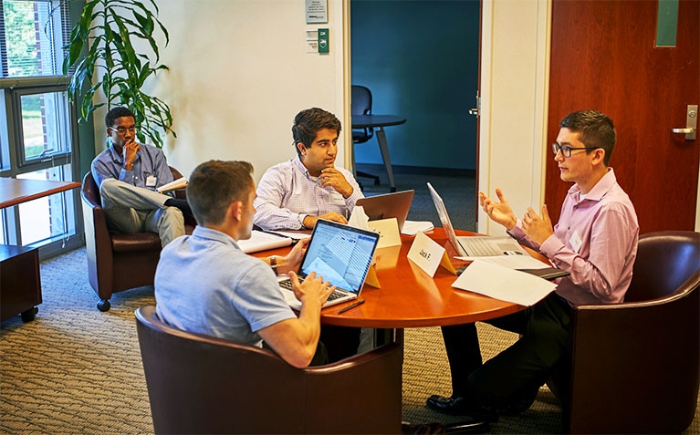 Leadership Development Center participants having a team discussion