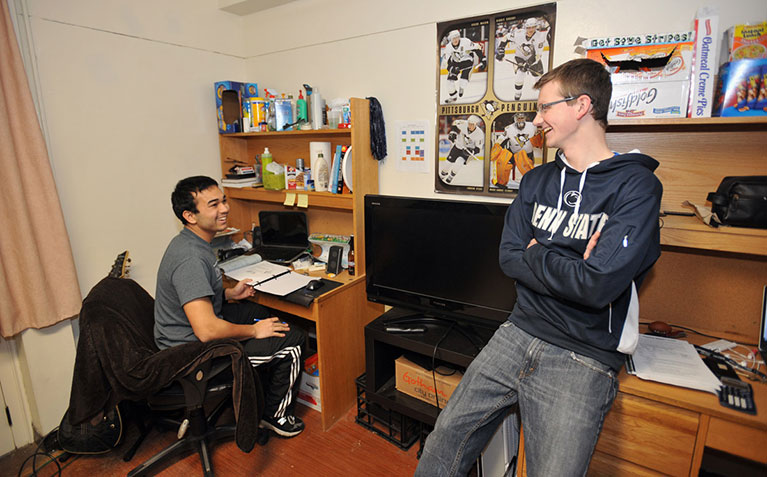 Scholars talking in their room in Atherton Hall