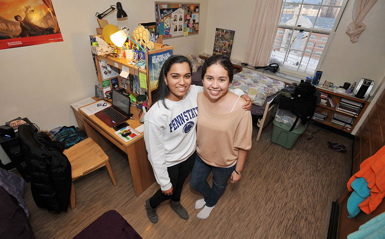 Scholars posing together in their room in Simmons Hall