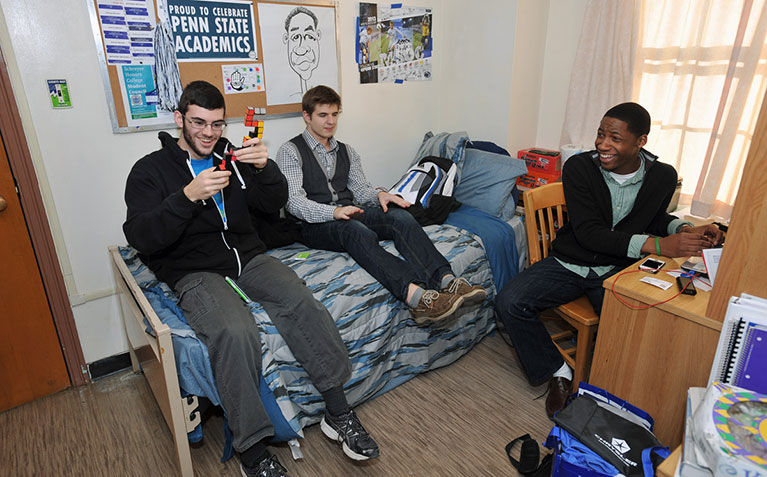 3 Scholars joking around in their Simmons Hall room