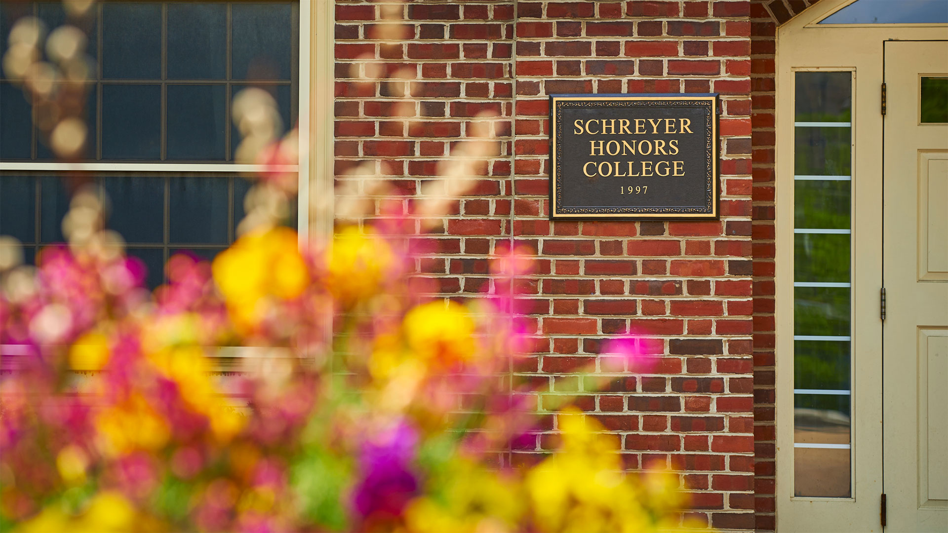 Honors College sign outside Atherton Hall