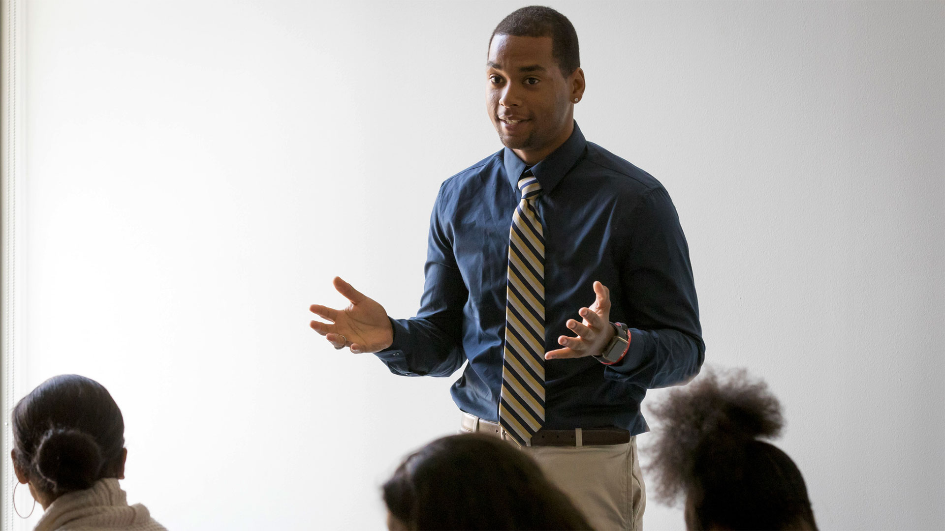 A high school counselor talking with a student